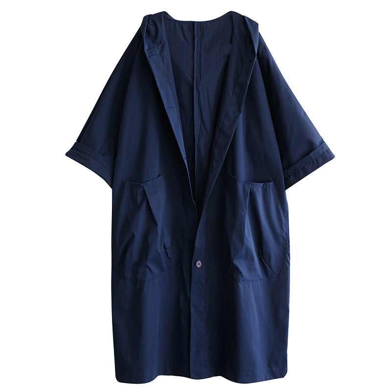 Side view of the oversized hooded coat with a relaxed drape and long sleeves