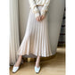 Ribbed wool midi skirt shown seated to show the drape