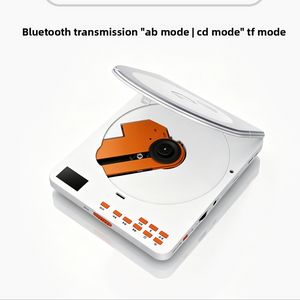 White portable CD player with the tinted lid raised on the orange laser sled