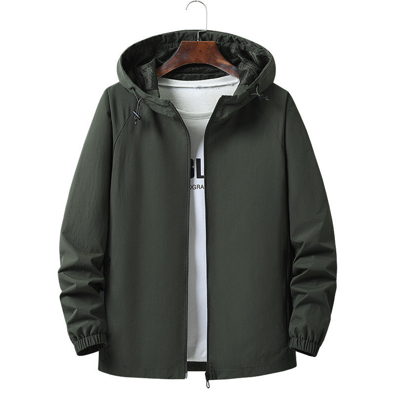 Army green nylon hooded jacket laid flat to show the loose cut