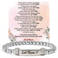 Stainless steel stretch bead bracelet with an engraved message bar, shown close up