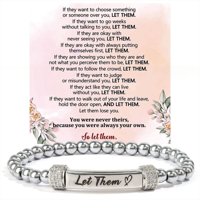 Stainless steel stretch bead bracelet with an engraved message bar, shown close up
