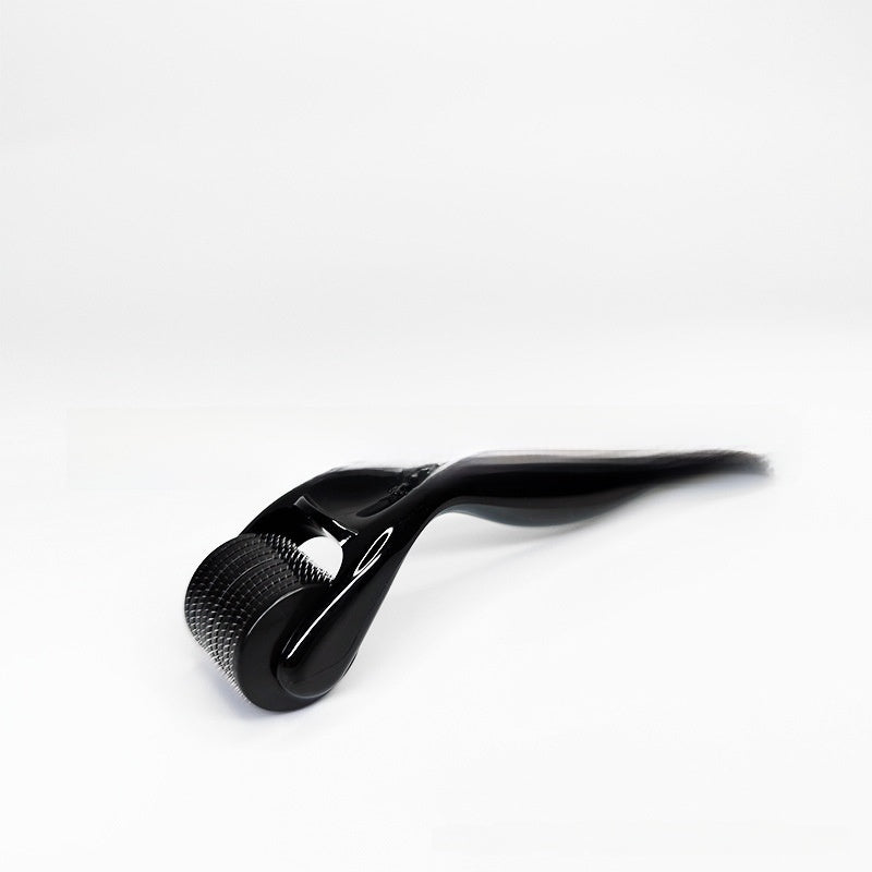Micro needle dermaroller styled on a clean neutral grooming surface