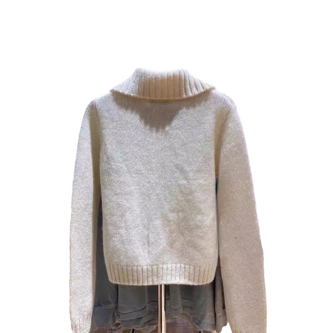 Back of a cream chunky knit cardigan with wide ribbed collar and ribbed hem on a white background