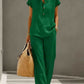 Green short-sleeve top and wide-leg pants set worn in a daily setting with a straw bag