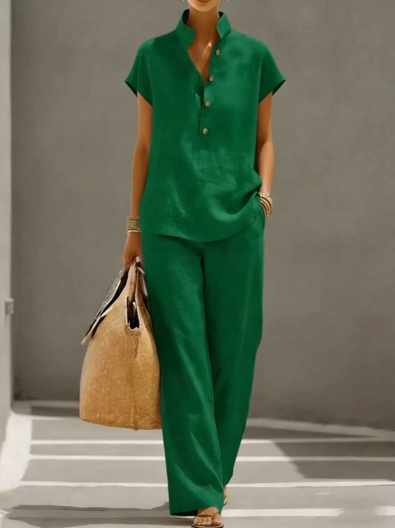 Green short-sleeve top and wide-leg pants set worn in a daily setting with a straw bag