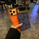 Diamond pattern magnetic iPhone cases shown in orange and navy, hard shell backs