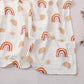 Pure cotton muslin swaddle blanket rolled up, showing the airy gauze texture and printed design