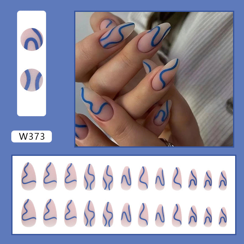 Full cover press-on almond nails in a blue ribbon design, glossy finish shown on a hand