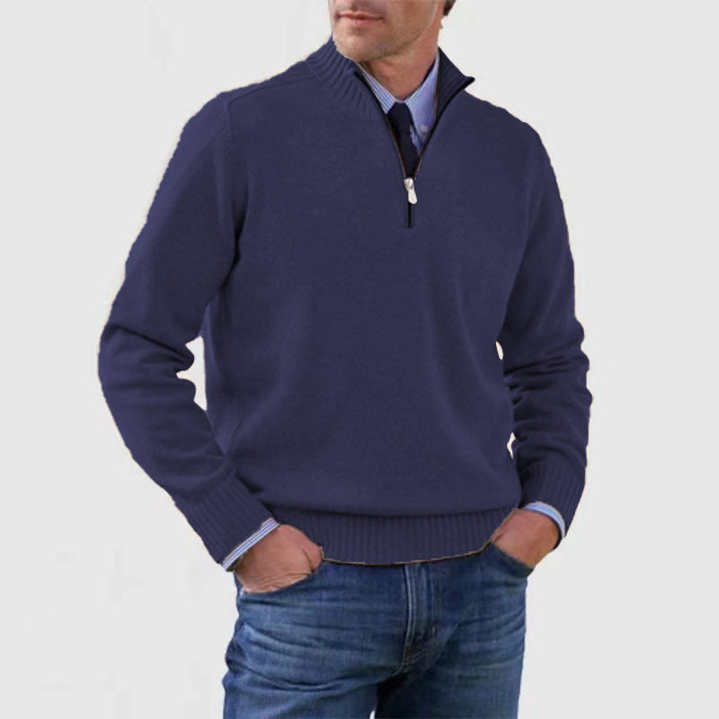 Dark blue mens acrylic knit quarter zip stand collar pullover sweater worn by a standing male model