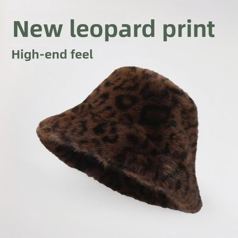 Brown leopard print plush bucket hat with a short brim on a white background