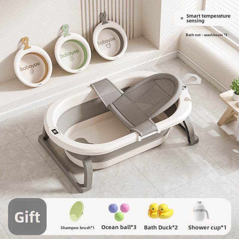 Baby bathtub with gray bath net across the basin and three washbasins hung on the wall
