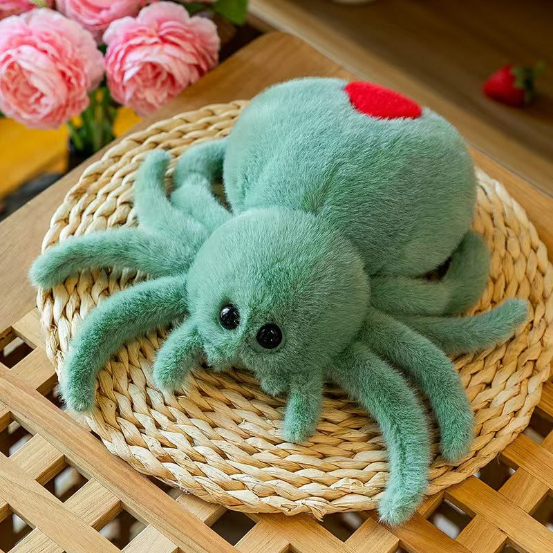 Reversible spider plush held in a hand to show the soft short plush body