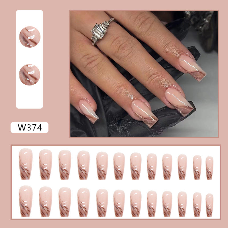 Full cover press-on almond nails in a blossom tip design, glossy finish shown on a hand