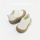 Khaki toddler breathable mesh slip on sports shoe seen from the side with a soft rounded rubber sole