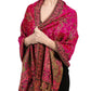 Rose red paisley tassel shawl wrap worn draped over the shoulders with tasseled fringe ends