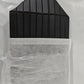 Ribbed stripe makeup organizer bag with a top handle and a wrap around zip on a plain background