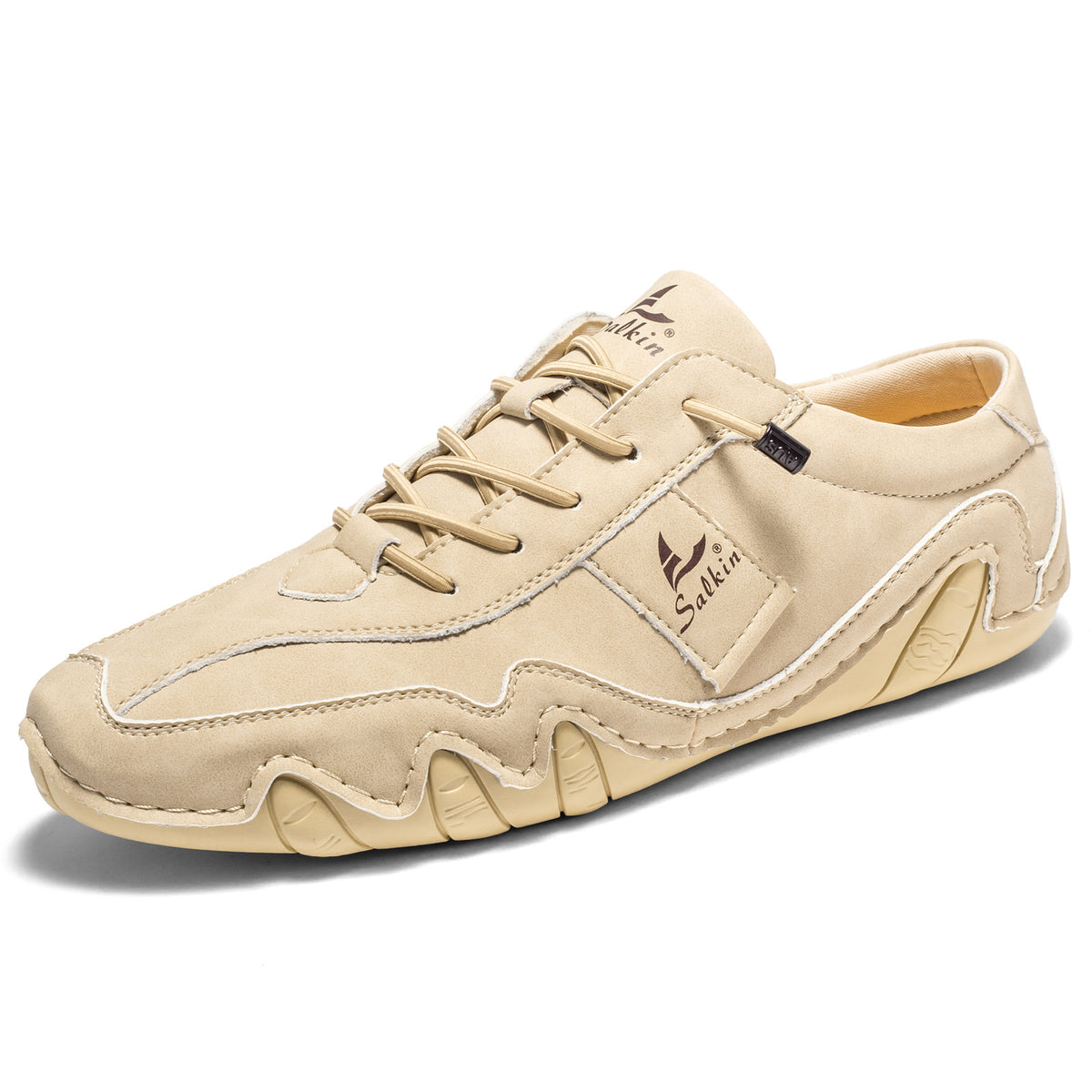 Beige microfiber low-top lace-up casual shoe with a wavy cream lug sole, three quarter view, size option 47