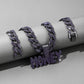 Letter money pendant worn on a Cuban link chain at the neck