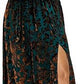 The floral velvet wrap dress worn with the waist tied and the skirt falling to the floor