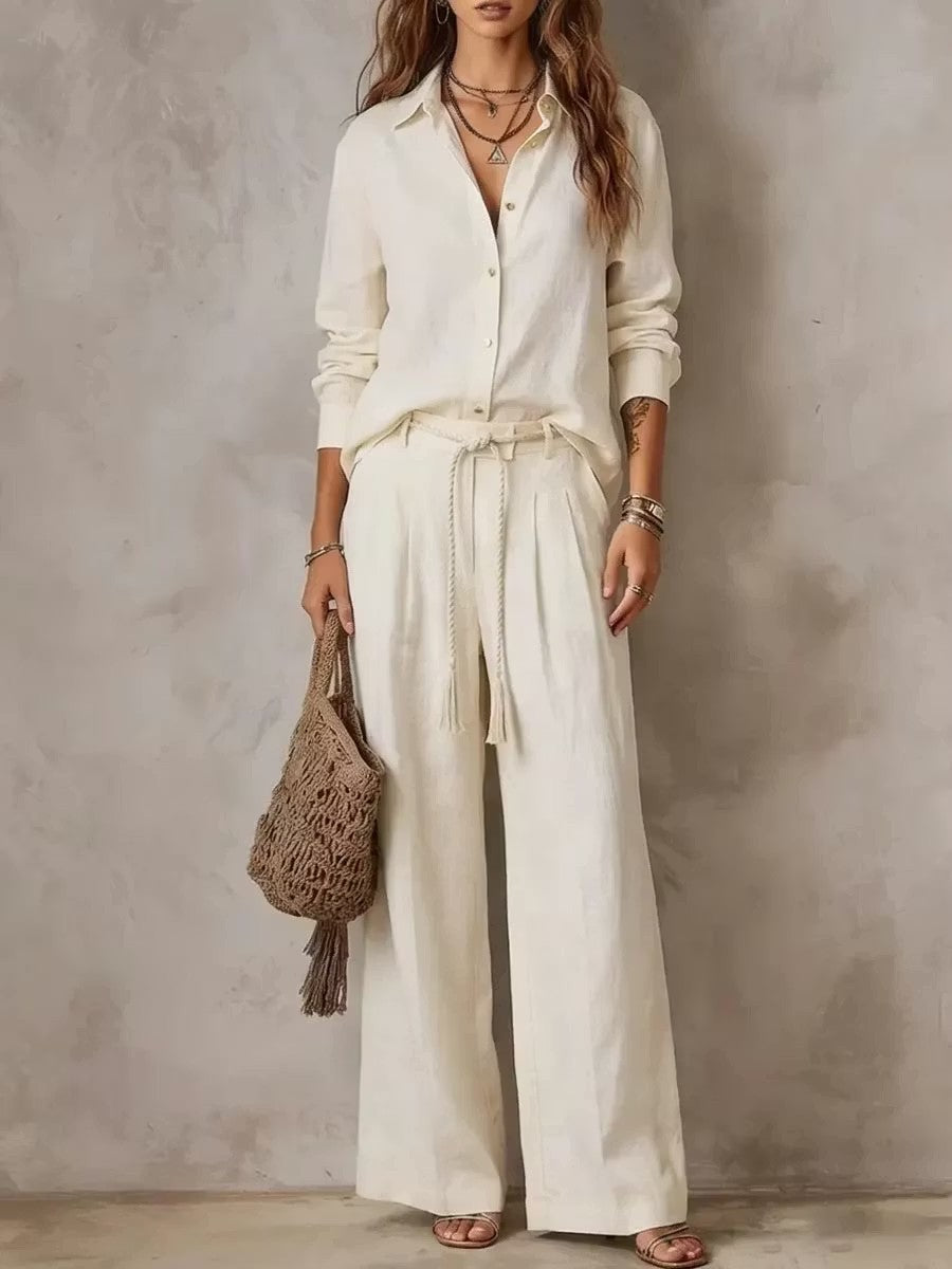 Woman in off white long sleeve shirt and wide leg pants set with braided tie belt, full length