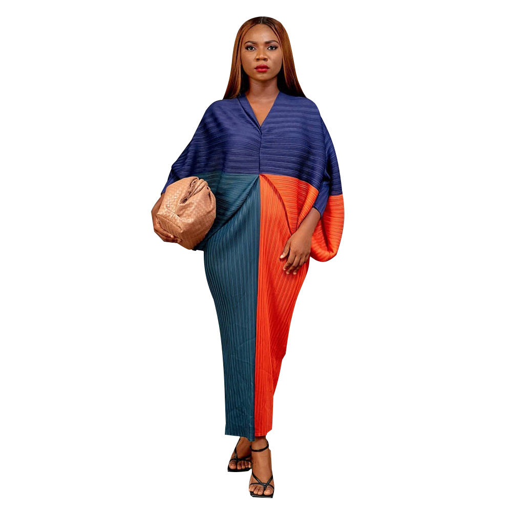 Free size pleated batwing midi dress with bold abstract print on a model, three quarter view