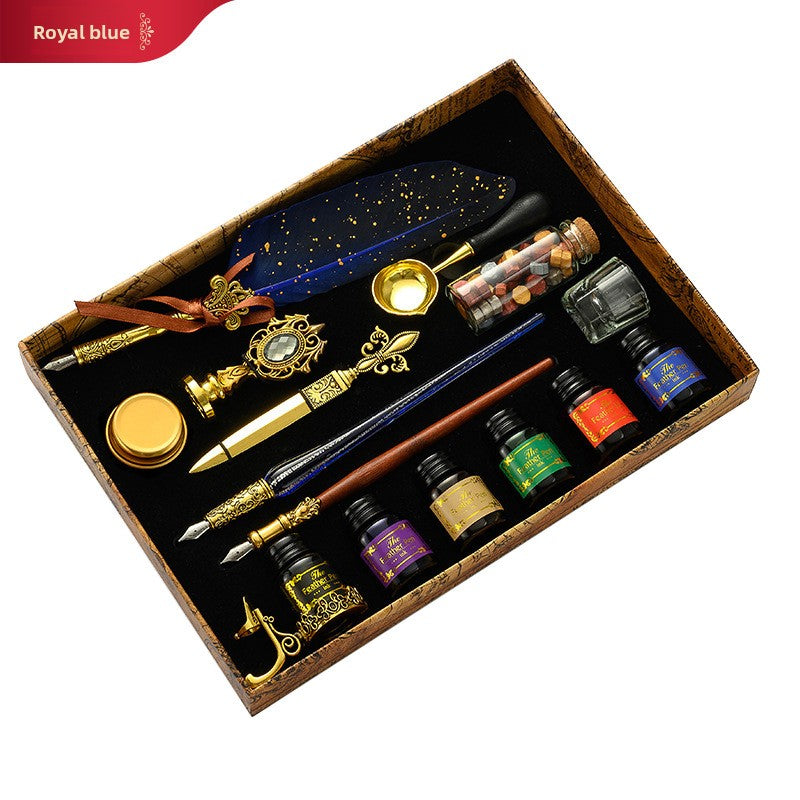 European style feather dip pen with a stainless steel nib, gold flecked resin barrel and ornate gold tone grip