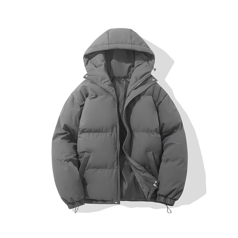 Hooded padded puffer jacket in dark gray, worn over a hoodie