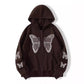 Angled view of the zip hoodie highlighting the rhinestone butterfly across the chest