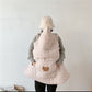 Squirrel face embroidered on the front pocket of the quilted baby cape