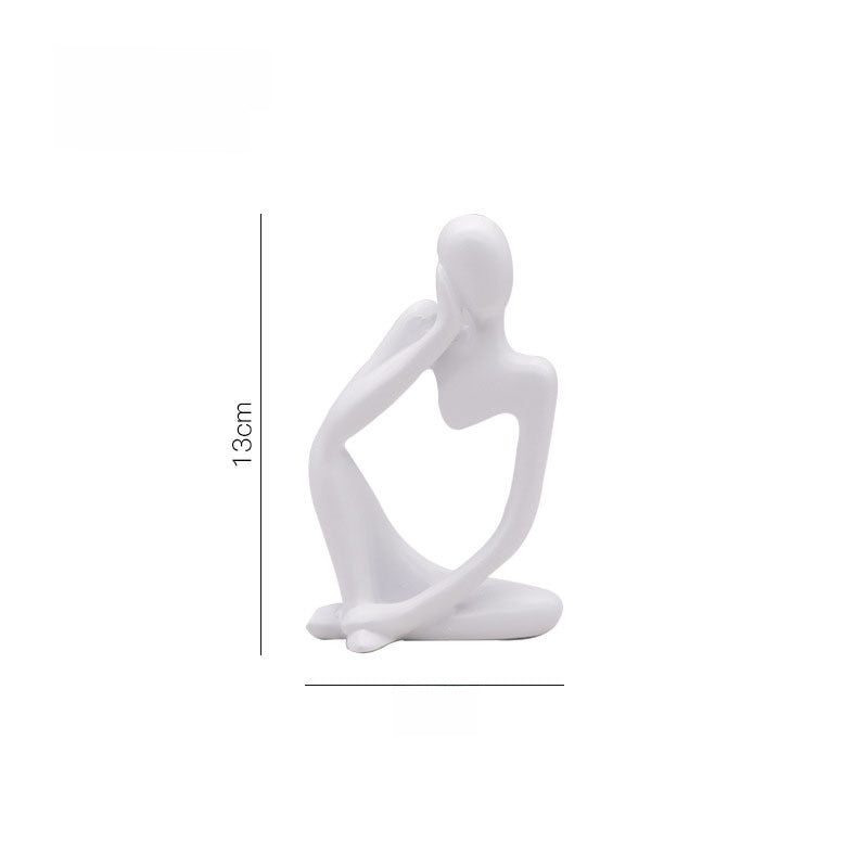 White abstract resin meditator figurine shown at about 13 cm tall against a plain background