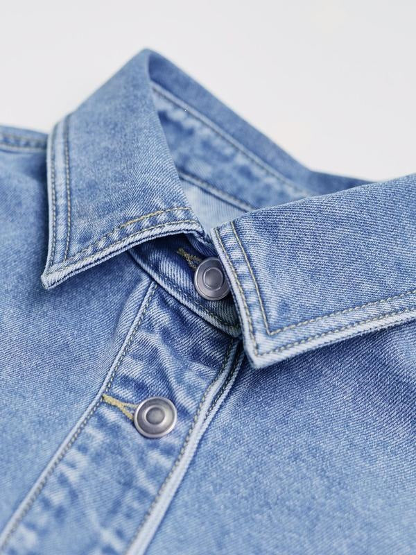 Close view of a pointed denim collar with contrast topstitching and two metal buttons on a washed blue jacket