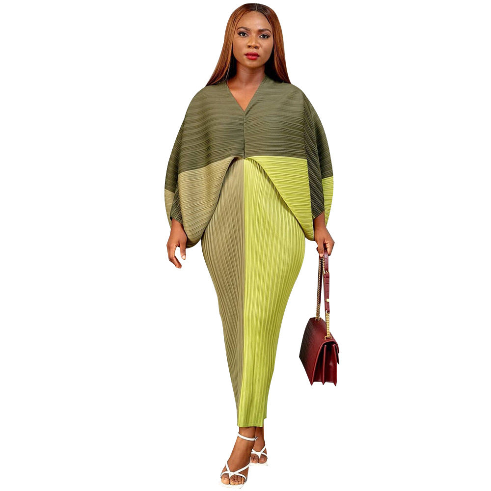 Colorful abstract print pleated batwing V neck midi dress on a model, standing pose