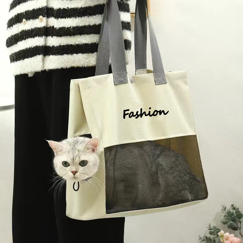 Gray cat carrier tote carried on the shoulder with a cat resting behind the front mesh window