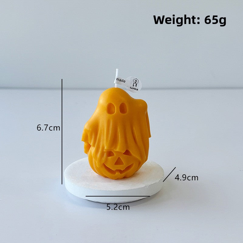 Ghost scented candle shown unlit on a shelf