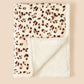 Flannel cartoon baby blanket spread as a floor play mat in natural light