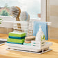 White steel sink caddy beside a sink with brushes, sponges and dish soap organised together