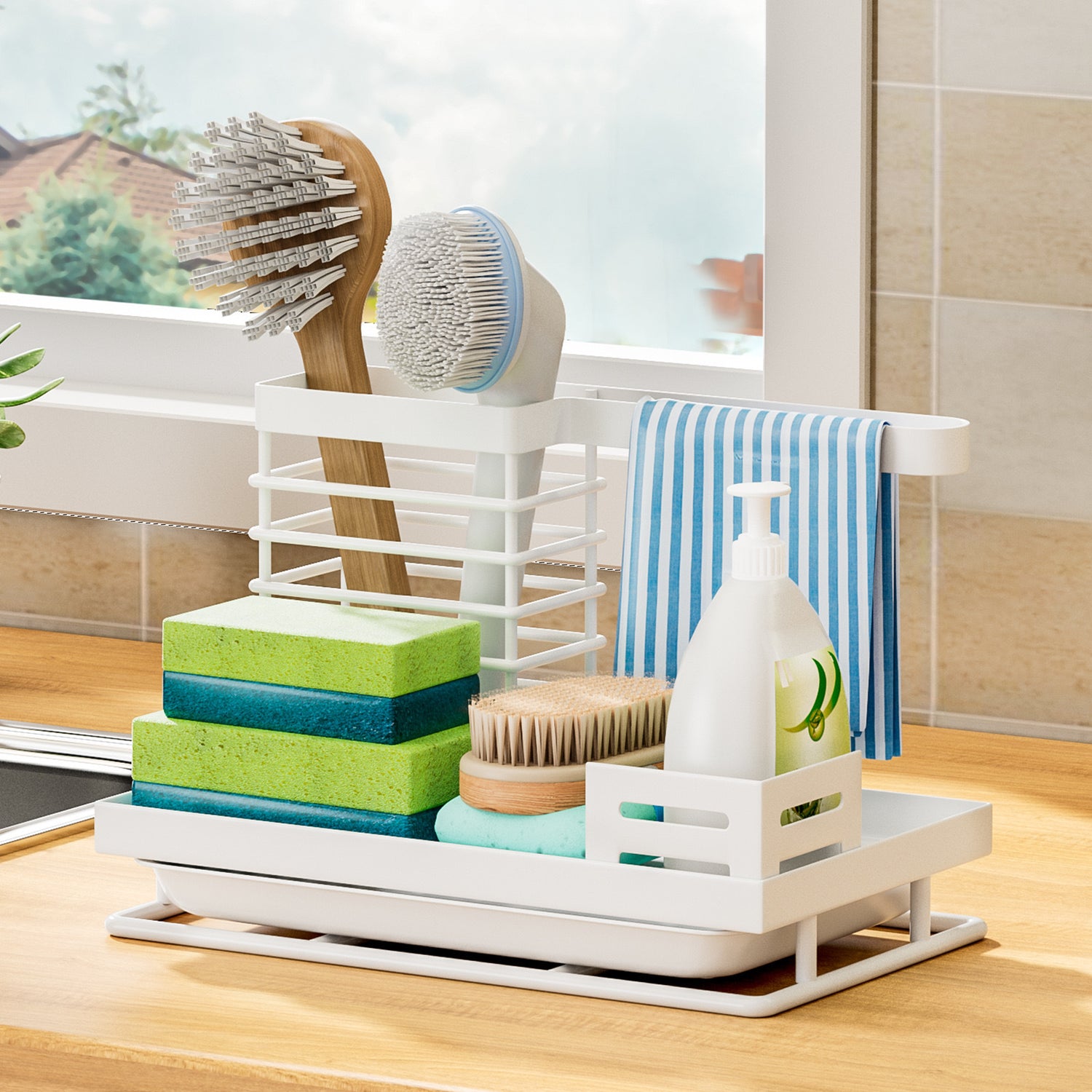 White steel sink caddy beside a sink with brushes, sponges and dish soap organised together