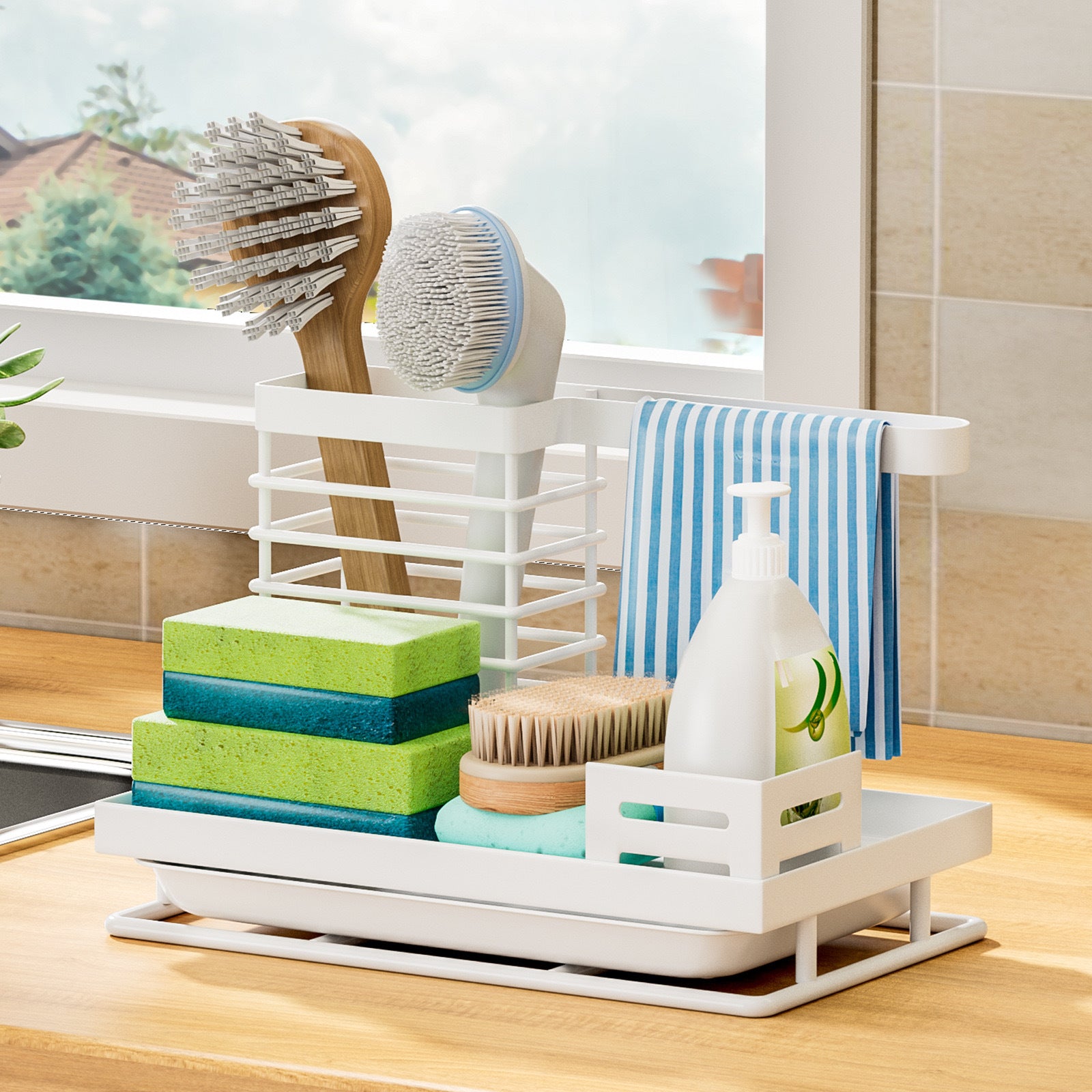 White steel sink caddy beside a sink with brushes, sponges and dish soap organised together