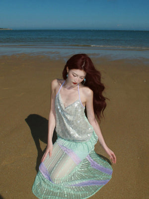 Side profile showing the sculpted fishtail flare at the hem