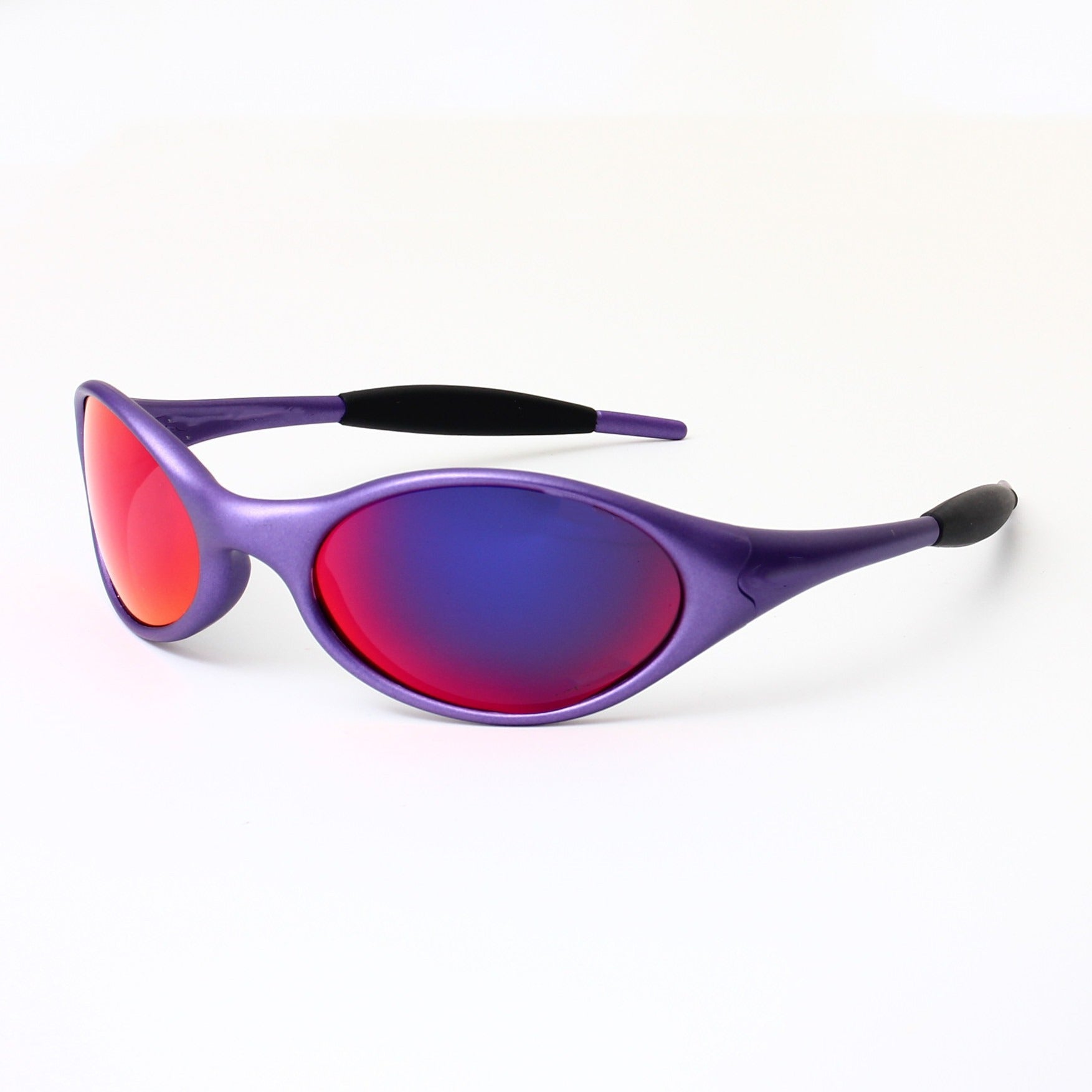 Wraparound sport sunglasses photographed in soft natural light styling