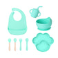 Cyan mint 8-piece baby feeding set with a bib, a sippy cup, a bowl, four utensils and a bear paw plate