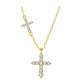 Gold tone sterling silver double cross necklace laid flat on a light background