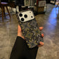 Black diamond pattern magnetic iPhone case, hard shell angled view