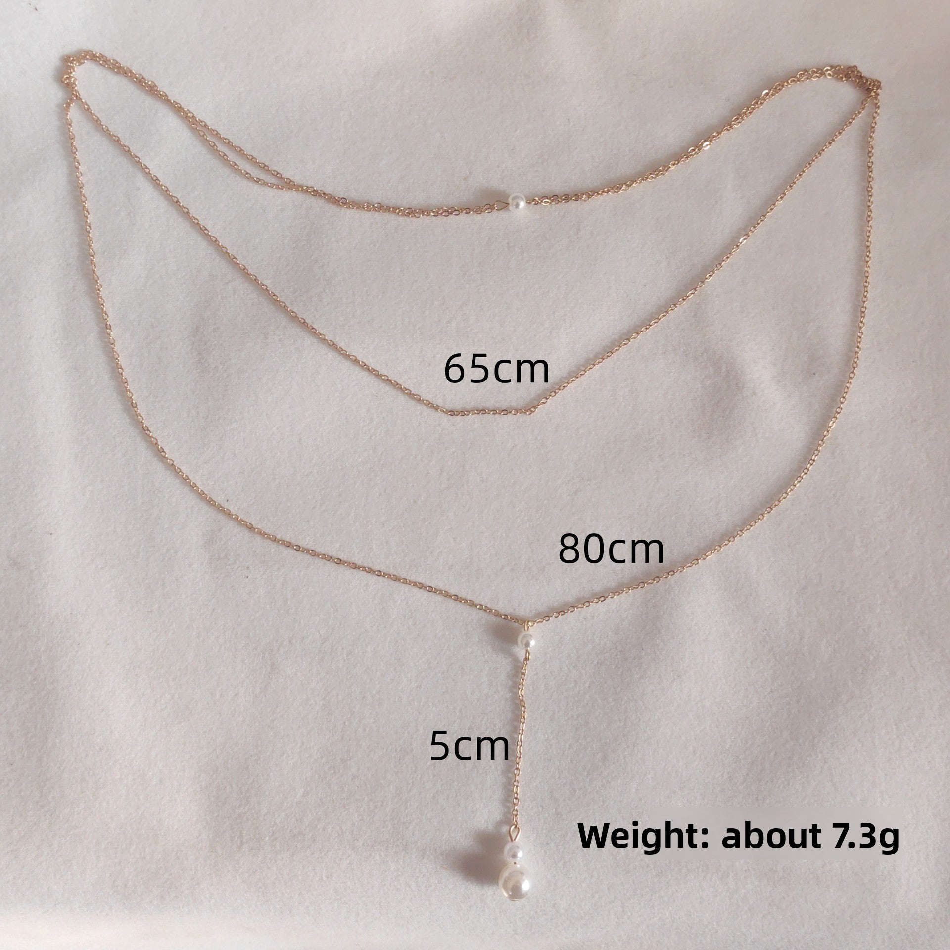 Rhinestone back drop necklace styled with an open back evening dress