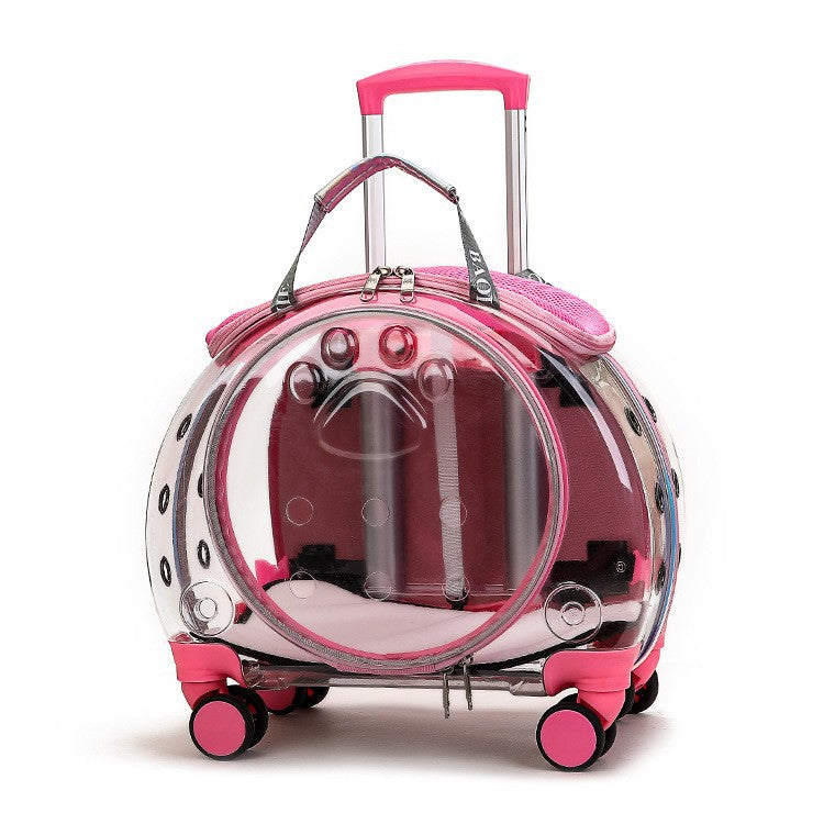 Transparent pink pet carrier on wheels with pink trim, a pink telescopic handle and a round clear door