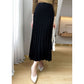 Back view of the high waist ribbed wool pleated midi skirt