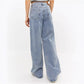 Back view of light wash wide leg jeans with patch pockets