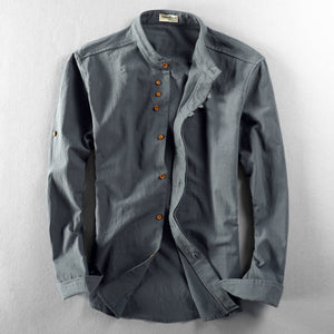 Side profile of the stand collar linen shirt showing the long sleeve and relaxed body