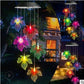 Maple leaf LED figures glowing in several colors, hanging from a solar lamp head, black housing option